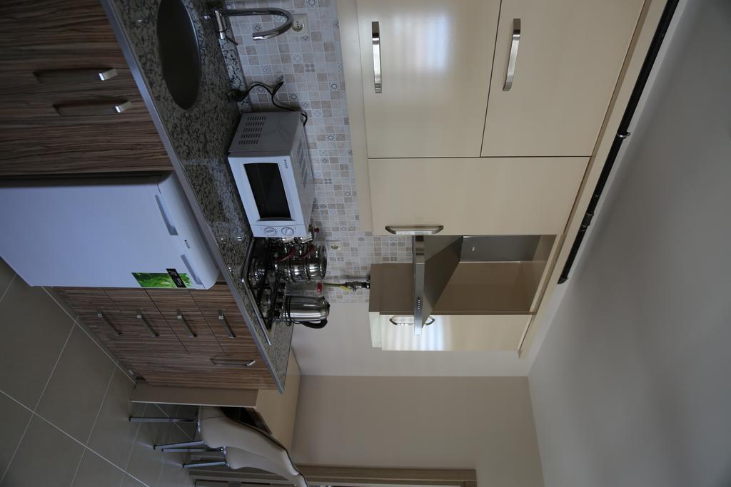 ウルギュップ Ozsoy Apartアパートホテル 部屋 写真